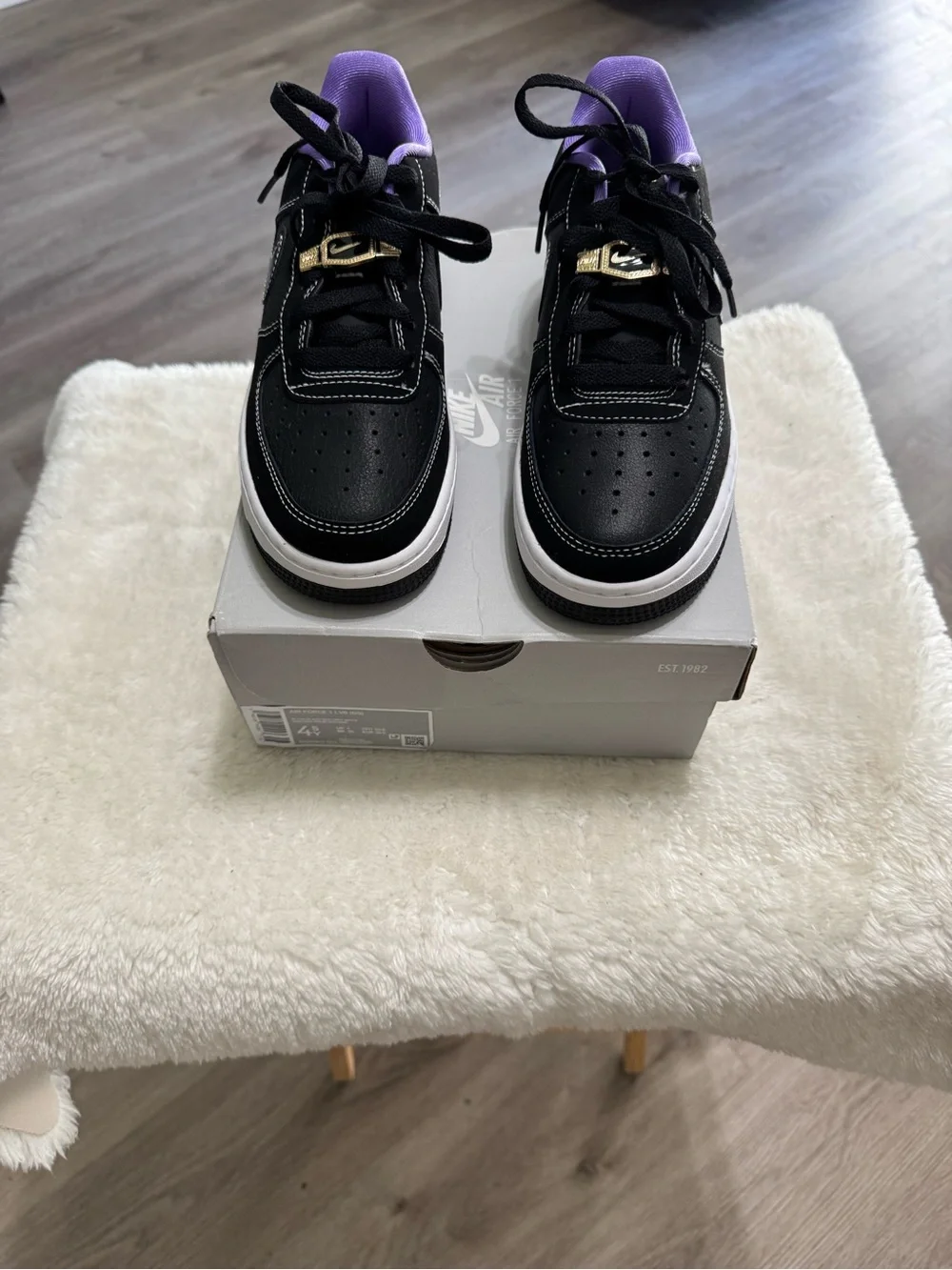Nike Kids Black Sneakers with Purple Lining and Gold Lace Accent
